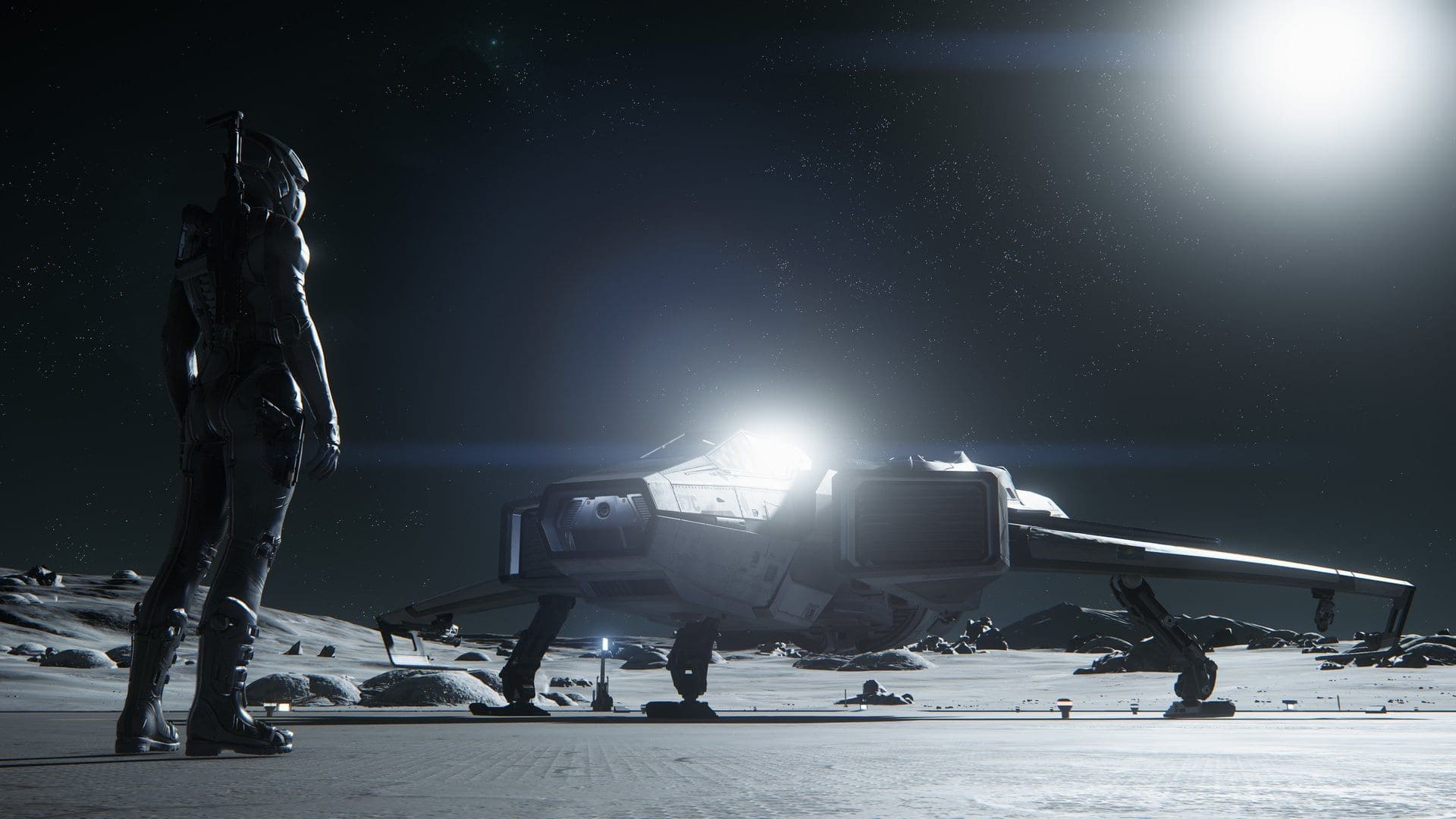 A Star Citizen player standing beside their ship on a moon surface under a starlit sky