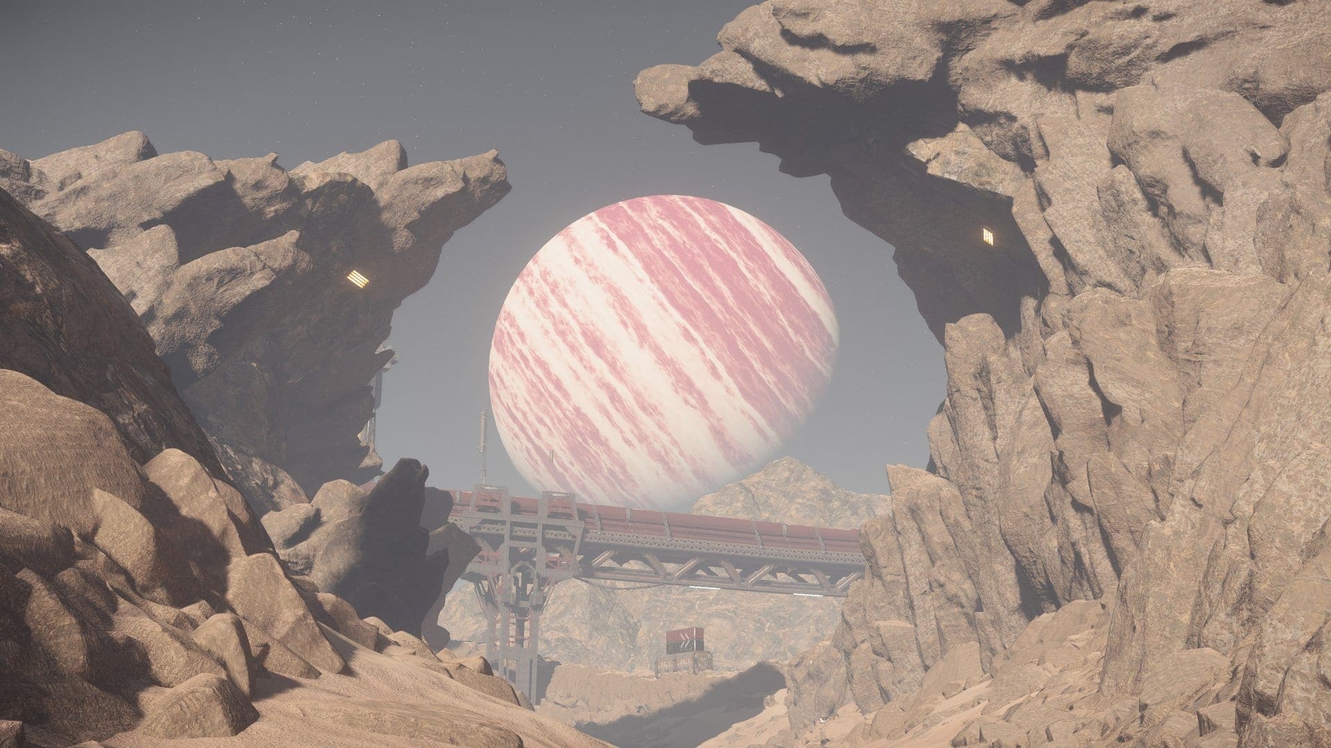 A gas giant planet visible through a rocky arch on a barren moon surface in Star Citizen, with an outpost in the distance